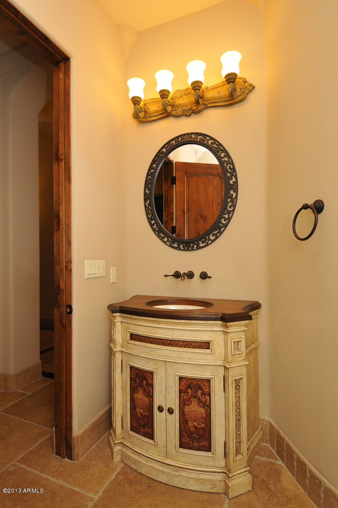 12827 East Cibola Road Scottsdale, AZ 85259 - Photo 26 of 64 a bathroom with a sink and a mirror