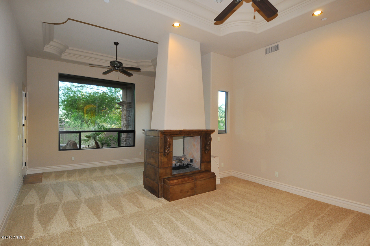 12827 East Cibola Road Scottsdale, AZ 85259 - Photo 27 of 64 a room with a window and a chandelier