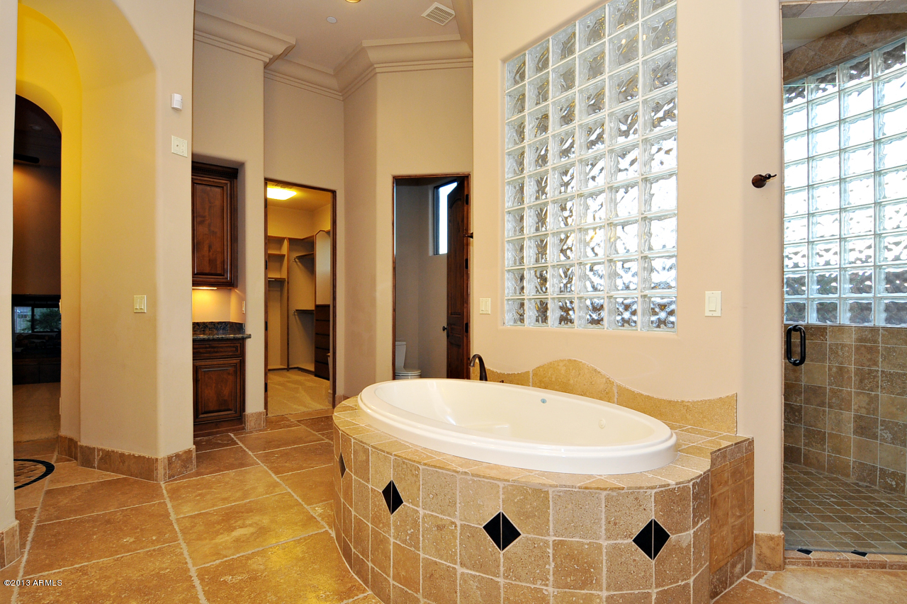 12827 East Cibola Road Scottsdale, AZ 85259 - Photo 32 of 64 a bathroom with a tub and shower