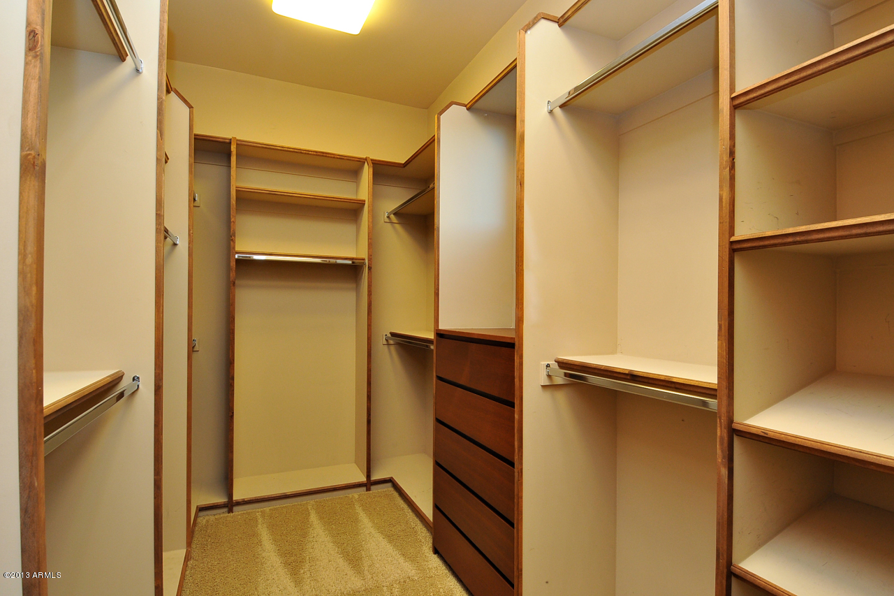 12827 East Cibola Road Scottsdale, AZ 85259 - Photo 33 of 64 a view of walk in closet with empty racks