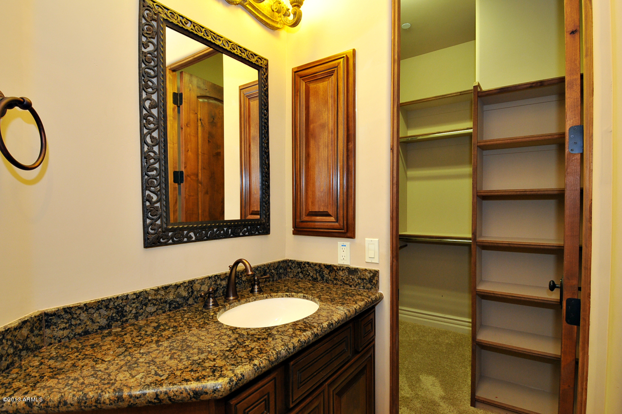 12827 East Cibola Road Scottsdale, AZ 85259 - Photo 42 of 64 a bathroom with a sink and a mirror