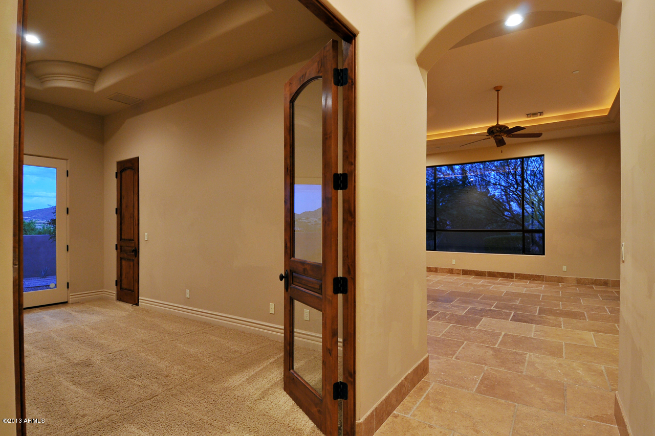 12827 East Cibola Road Scottsdale, AZ 85259 - Photo 44 of 64 a view of a hallway with wooden floor