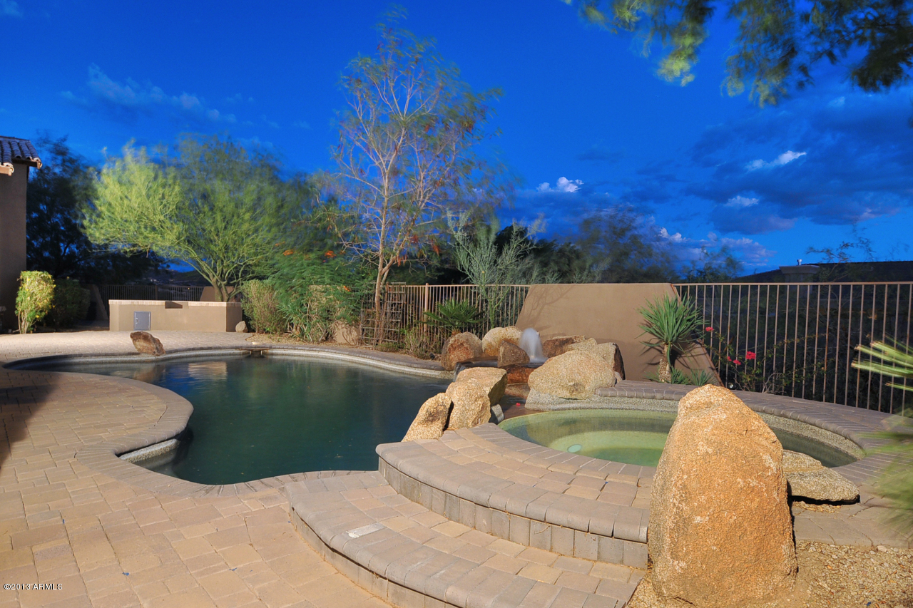 12827 East Cibola Road Scottsdale, AZ 85259 - Photo 47 of 64 a view of a swimming pool with a patio and a yard
