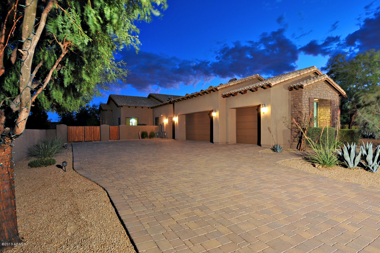 12827 East Cibola Road Scottsdale, AZ 85259 - Photo 53 of 64 a view of a white house with a yard and large tree