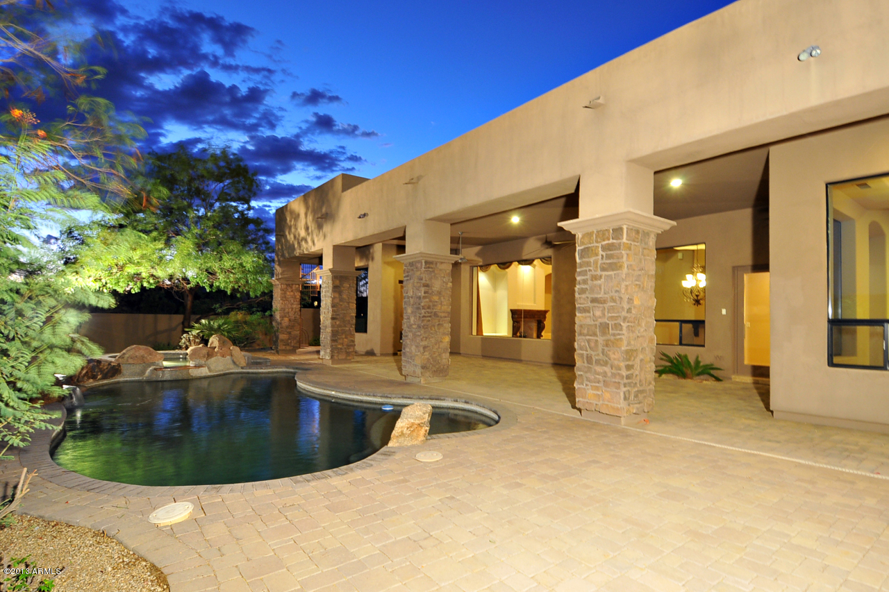 12827 East Cibola Road Scottsdale, AZ 85259 - Photo 56 of 64 a view of a swimming pool with a patio