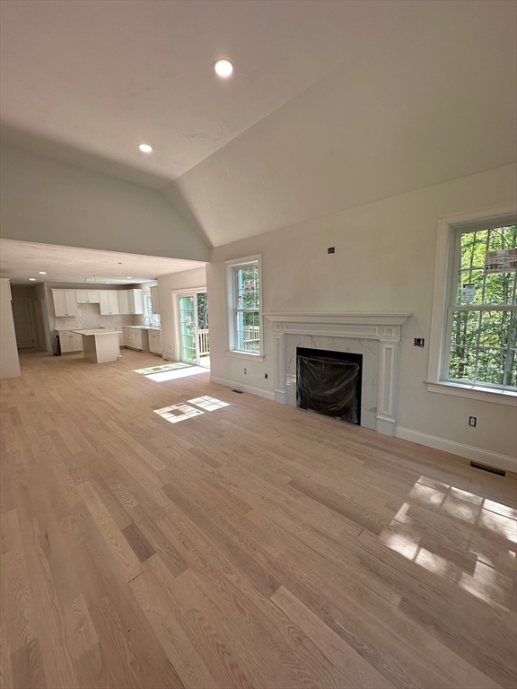 881 Maple Street Mansfield, MA 02048 - Photo 11 of 34 a view of an empty room with a fireplace and a window