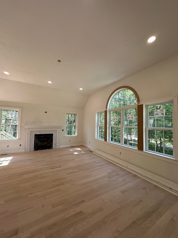 881 Maple Street Mansfield, MA 02048 - Photo 12 of 34 a view of an empty room with a fireplace and a window