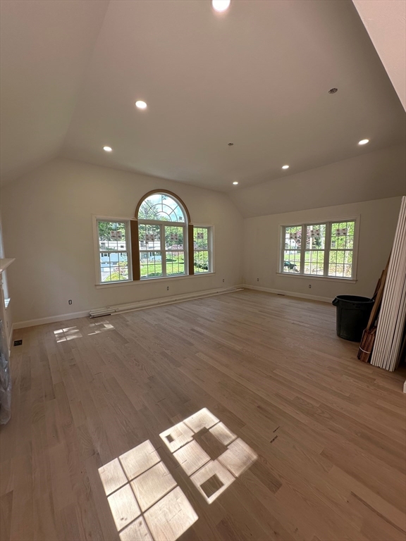 881 Maple Street Mansfield, MA 02048 - Photo 13 of 34 a view of an empty room with a window and wooden floor
