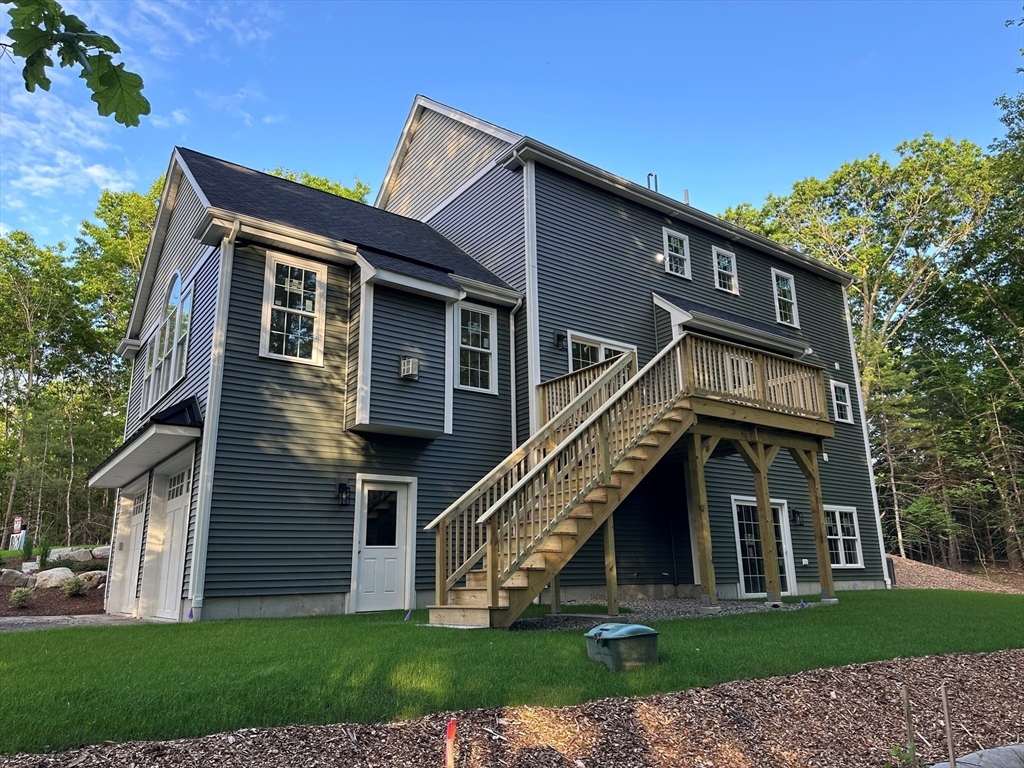 881 Maple Street Mansfield, MA 02048 - Photo 2 of 34 a view of a house with a yard