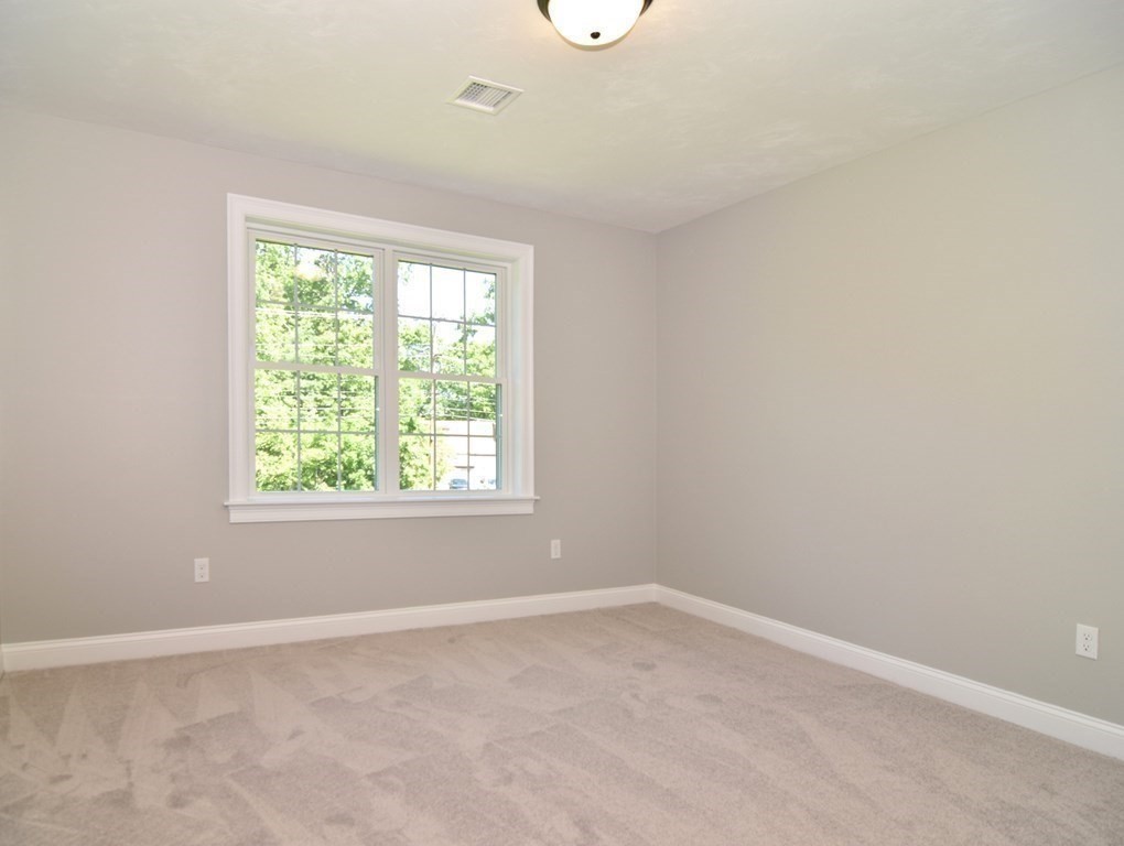881 Maple Street Mansfield, MA 02048 - Photo 21 of 34 an empty room with a window