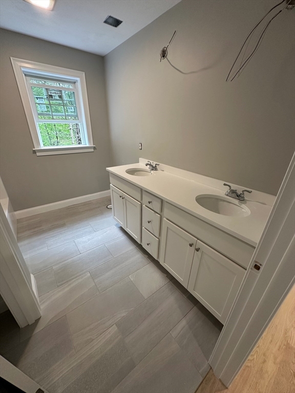 881 Maple Street Mansfield, MA 02048 - Photo 25 of 34 a spacious bathroom with a tub sink and mirror