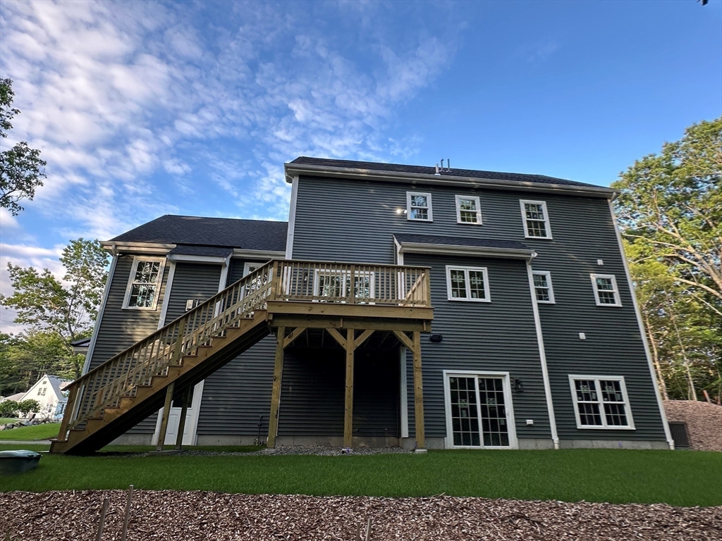 881 Maple Street Mansfield, MA 02048 - Photo 30 of 34 a front view of a house with a garden