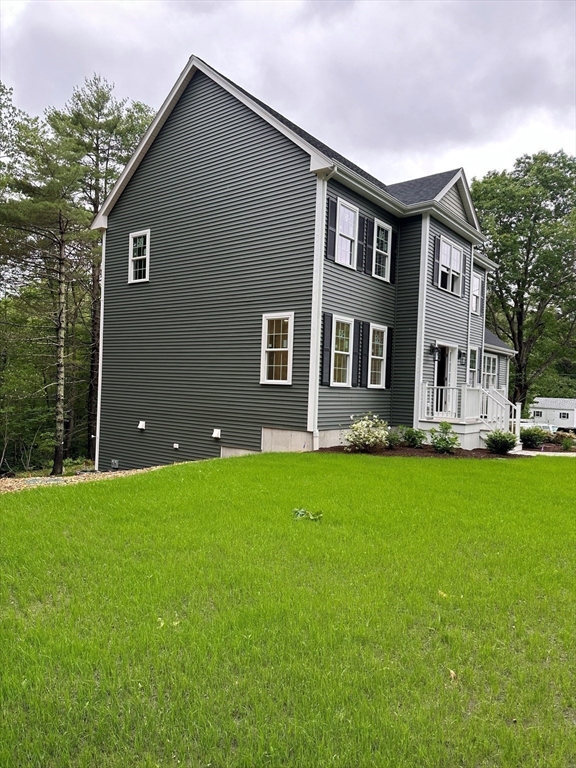 881 Maple Street Mansfield, MA 02048 - Photo 32 of 34 a house view with a garden space