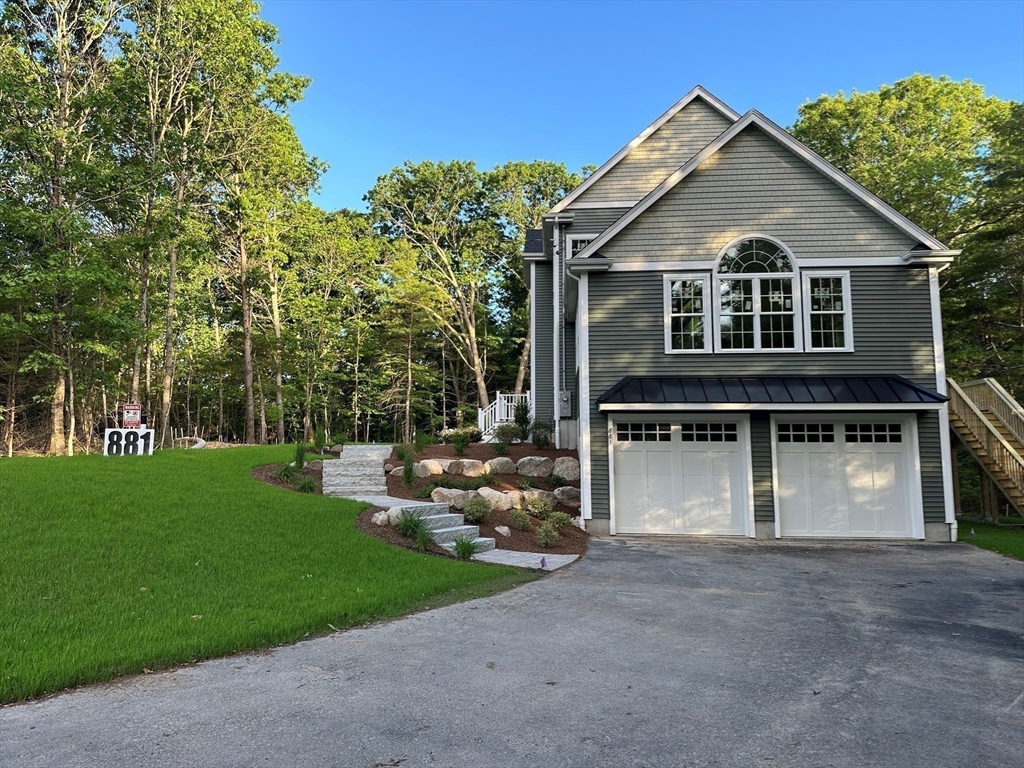 881 Maple Street Mansfield, MA 02048 - Photo 4 of 34 a front view of a house with garden
