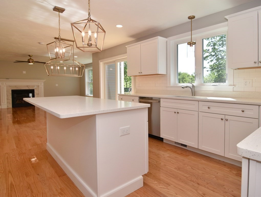 881 Maple Street Mansfield, MA 02048 - Photo 9 of 34 a kitchen with a sink a window and cabinets