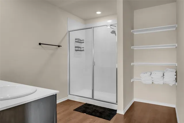 a en suite bathroom with a sink and a mirror