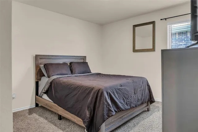 a bedroom with a bed and closet