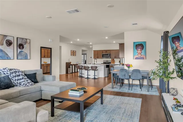 a view of kitchen with furniture and wooden floor