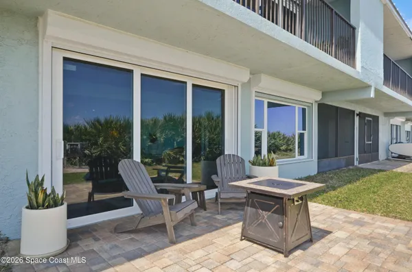a view of a house with swimming pool and porch