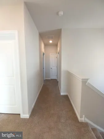 a view of hallway hall with wooden floor
