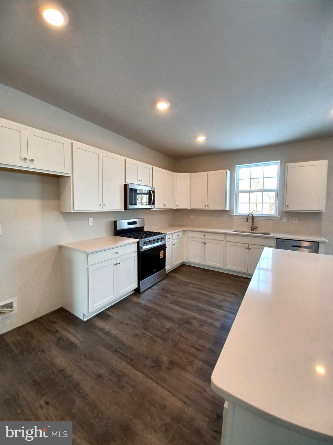 114 Winding Road Easton, PA 18040 - Photo 10 of 33 a large kitchen with stainless steel appliances granite countertop a stove a sink and a refrigerator