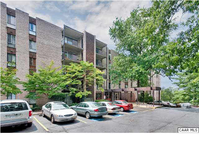 511 1st Street North, Unit 203 Charlottesville, VA 22902 - Photo 1 of 9 a view of a cars park in front of a building