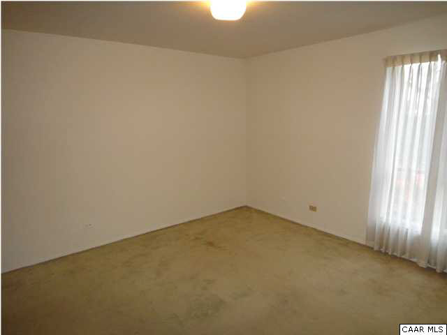 511 1st Street North, Unit 203 Charlottesville, VA 22902 - Photo 8 of 9 an empty room with a window