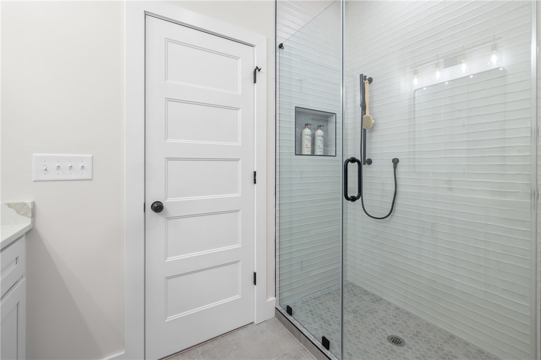 502 Point Road Westminster, SC 29693 - Photo 18 of 45 This sleek bathroom features a modern glass shower with clean lines and contemporary finishes.