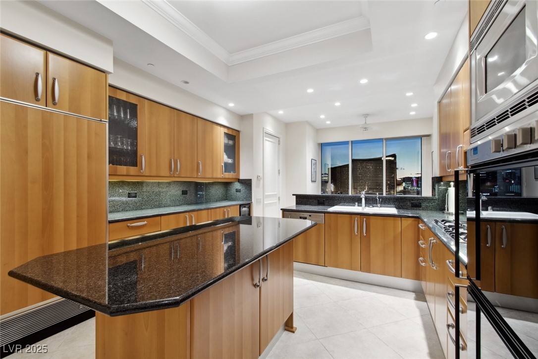 2877 Paradise Road, Unit 2703 Las Vegas, NV 89109 - Photo 5 of 10 CHEF'S KITCHEN WITH GAS COOKTOP, SUBZERO REFRIGERATOR, GAGGANEAU APPLIANCES