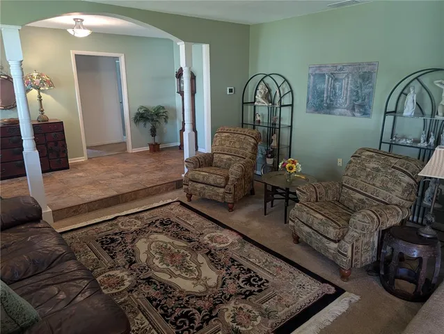a living room with furniture and a window