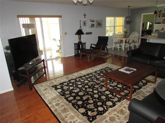 a living room with furniture and a rug