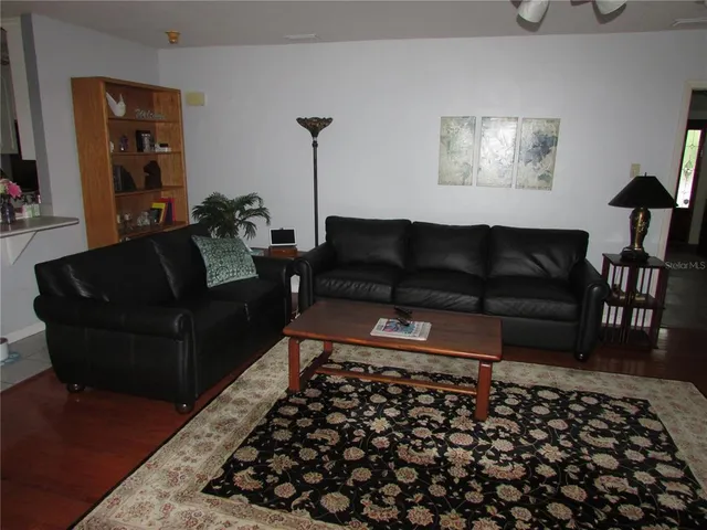 a kitchen with a fireplace and cabinets