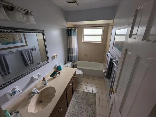 a kitchen with a refrigerator and a stove