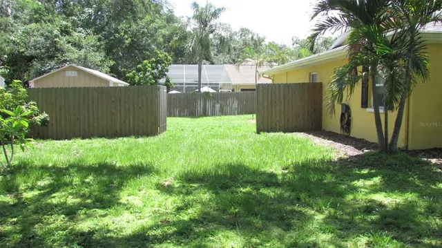 a view of a livingroom with furniture and windows