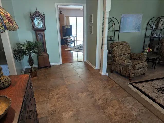 a living room with furniture and a rug