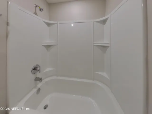 a close view of a bathtub in bathroom