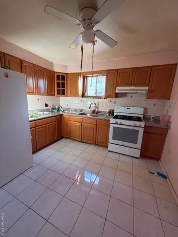 a kitchen with stainless steel appliances granite countertop a sink and cabinets