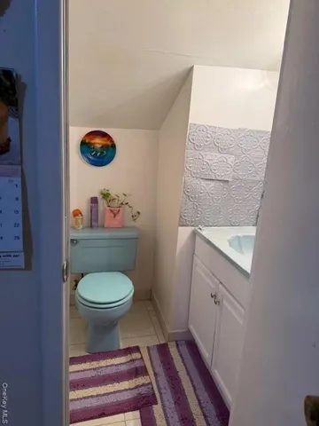 a bathroom with a toilet and a sink