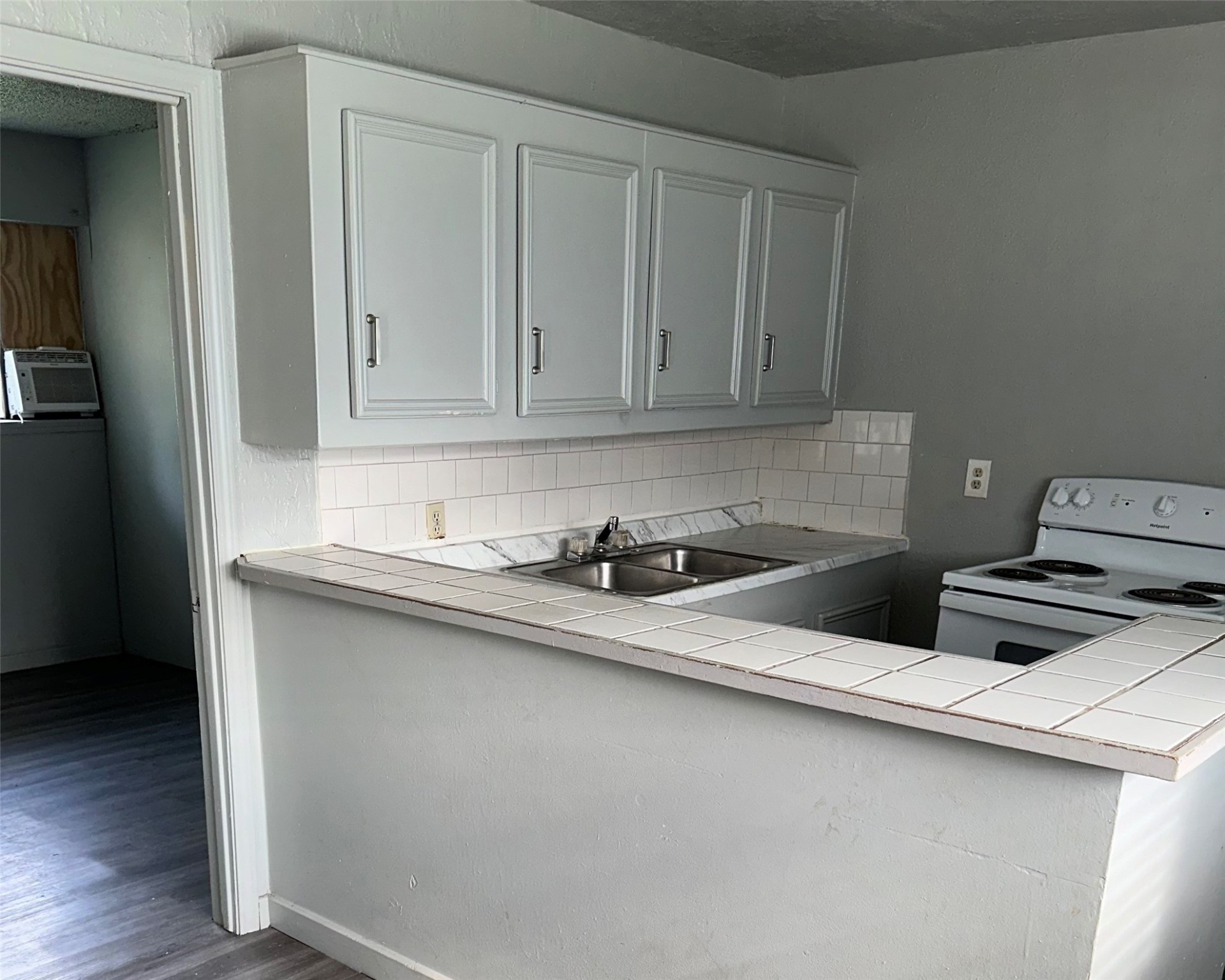5409 Suez Street, Unit 3 Houston, TX 77020 - Photo 2 of 15 a kitchen with stainless steel appliances a sink stove and cabinets