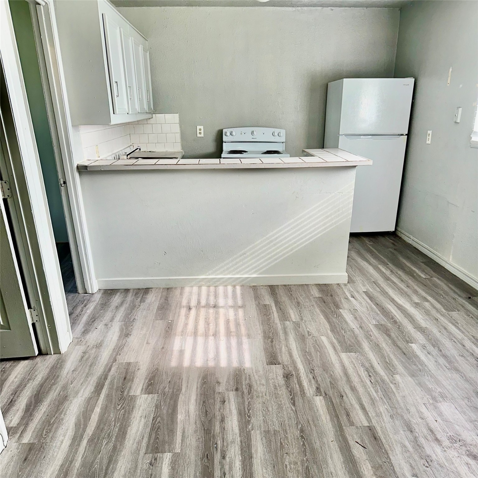5409 Suez Street, Unit 3 Houston, TX 77020 - Photo 3 of 15 a view of a room with wooden floor