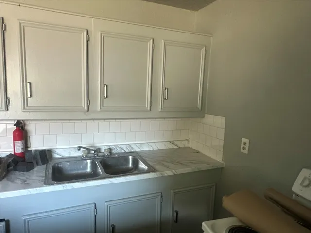 a bathroom with a sink toilet and vanity
