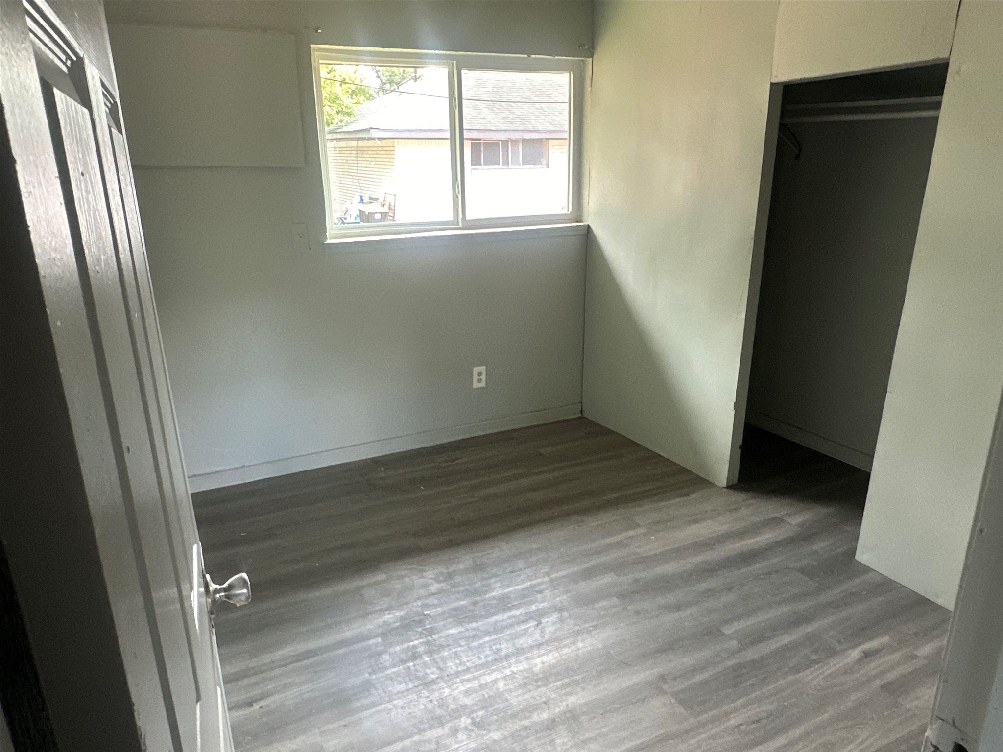 5409 Suez Street, Unit 3 Houston, TX 77020 - Photo 6 of 15 a view of an empty room with wooden floor and a window