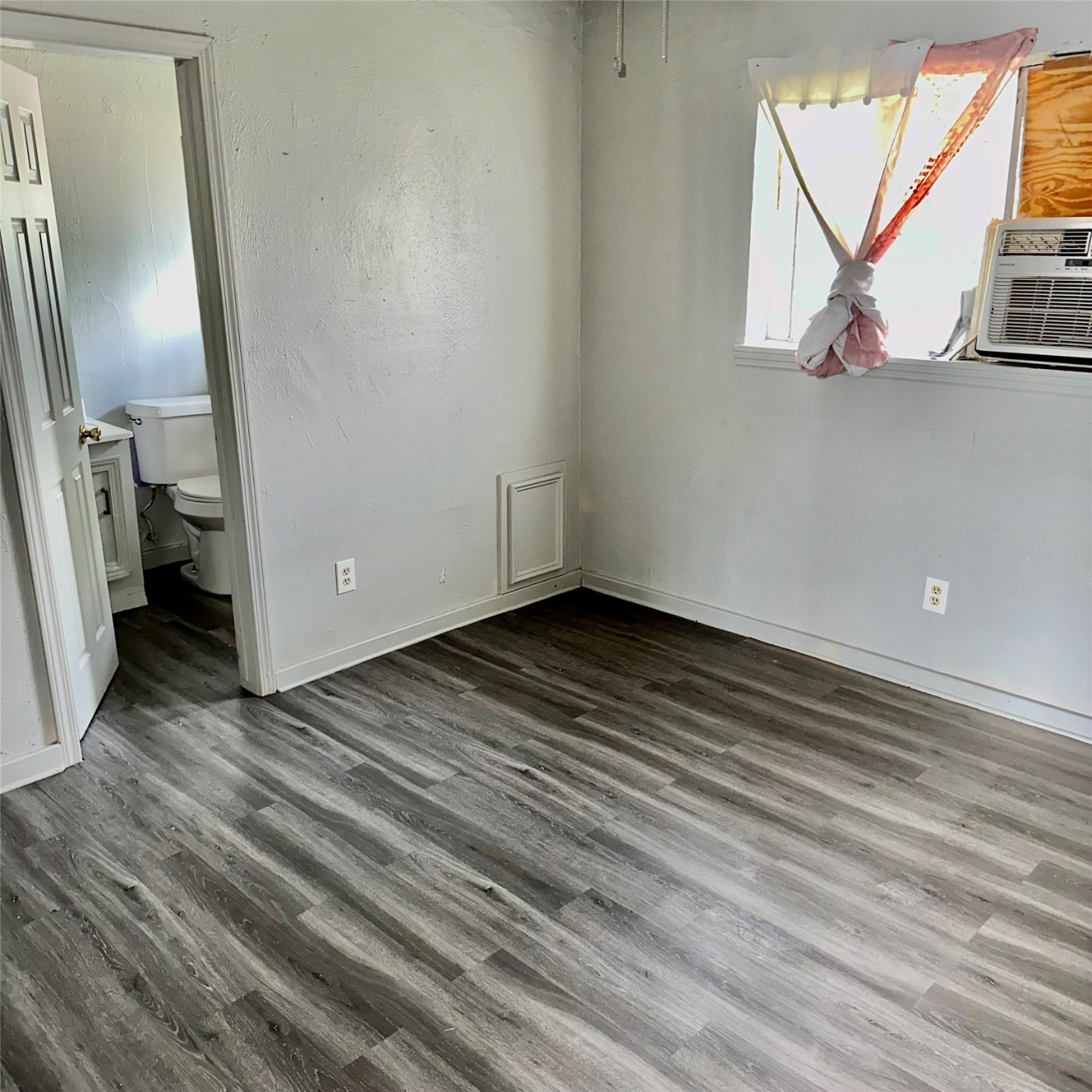 5409 Suez Street, Unit 3 Houston, TX 77020 - Photo 9 of 15 a view of a room with wooden floor and a large window