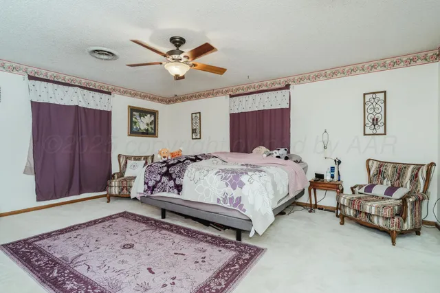 a bed room with a bed and window