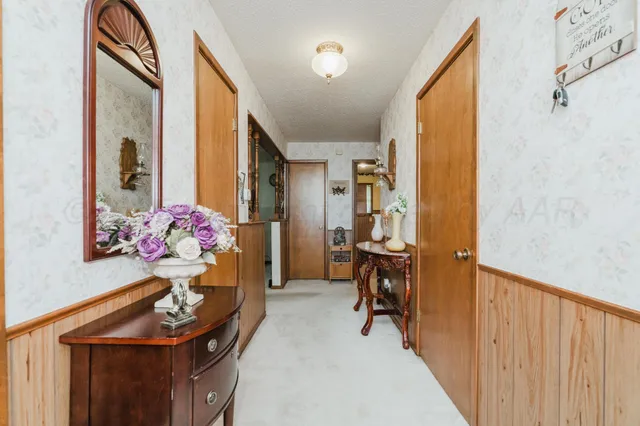 a view of living room with furniture and a chandelier