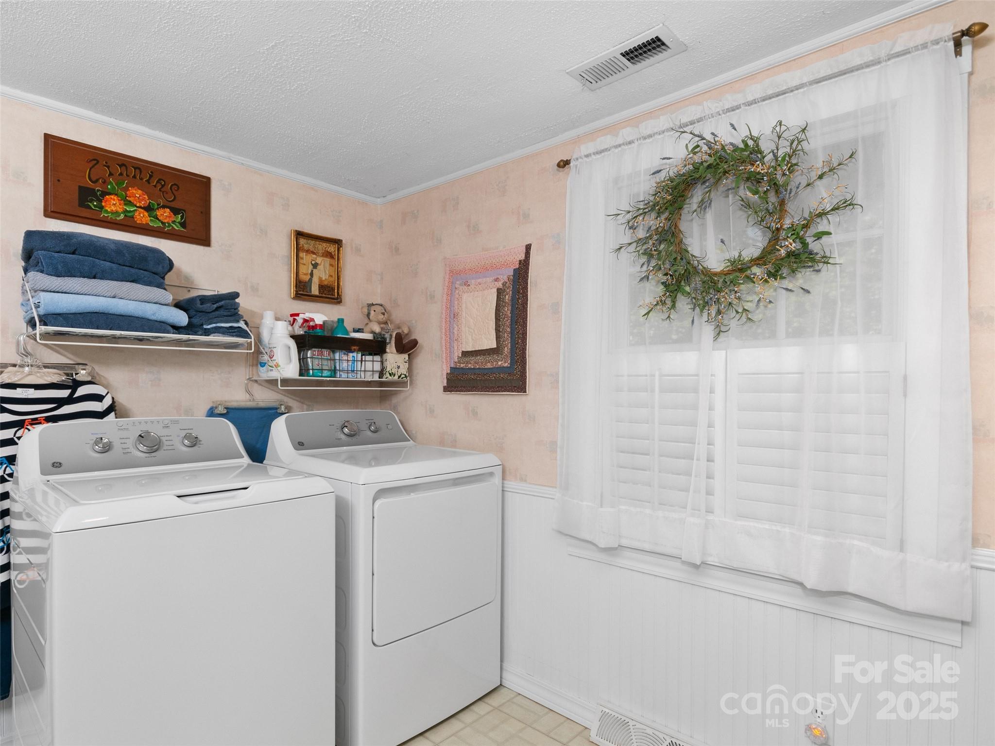 229 Crabtree Mountain Road Canton, NC 28716 - Photo 14 of 42 a view of storage and utility room with a washer dryer
