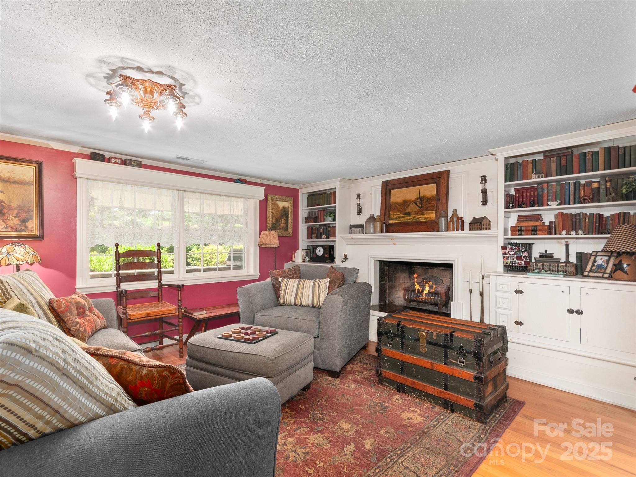 229 Crabtree Mountain Road Canton, NC 28716 - Photo 15 of 42 a living room with furniture and a fireplace