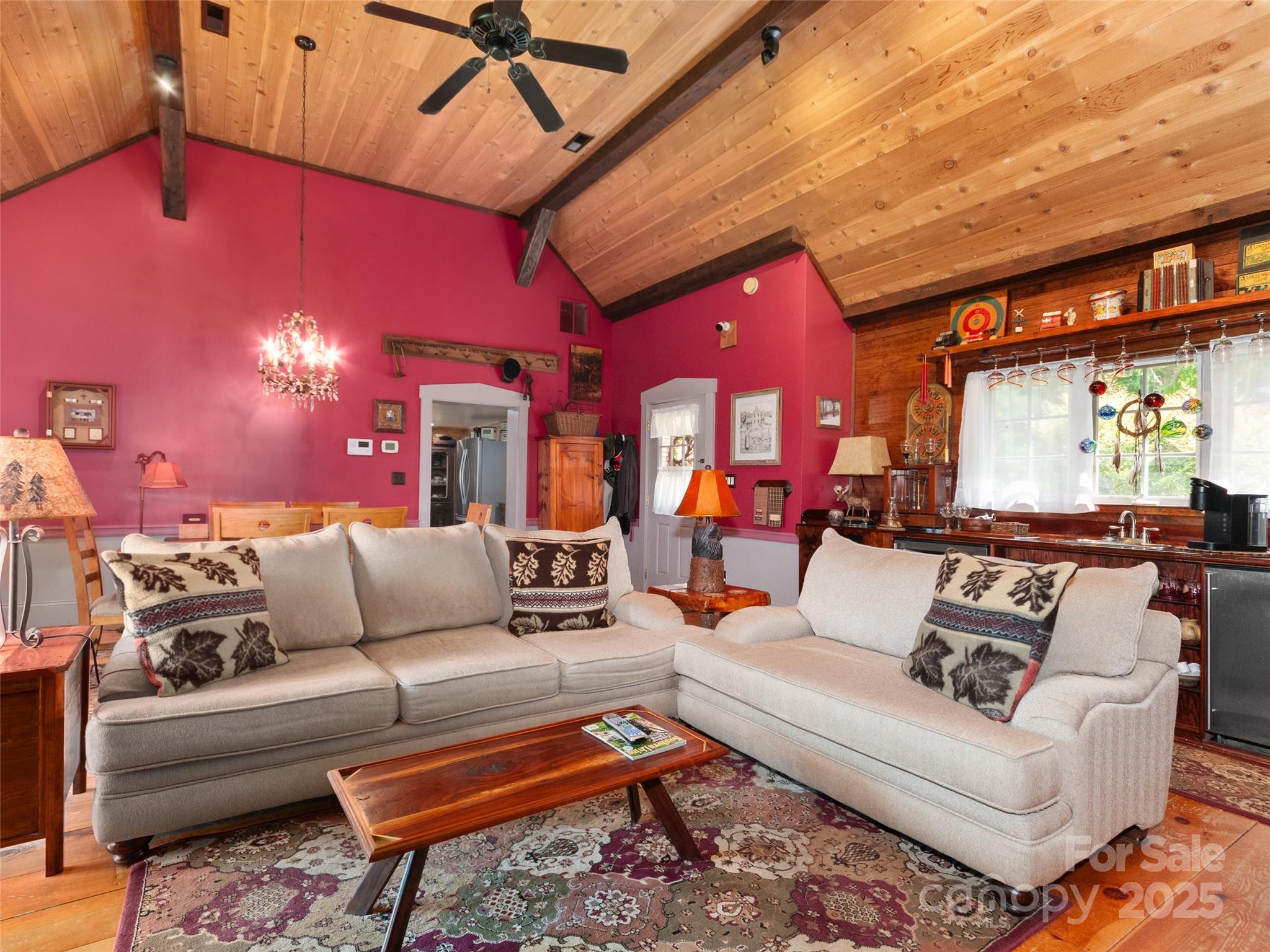 229 Crabtree Mountain Road Canton, NC 28716 - Photo 21 of 42 a living room with furniture and a large window