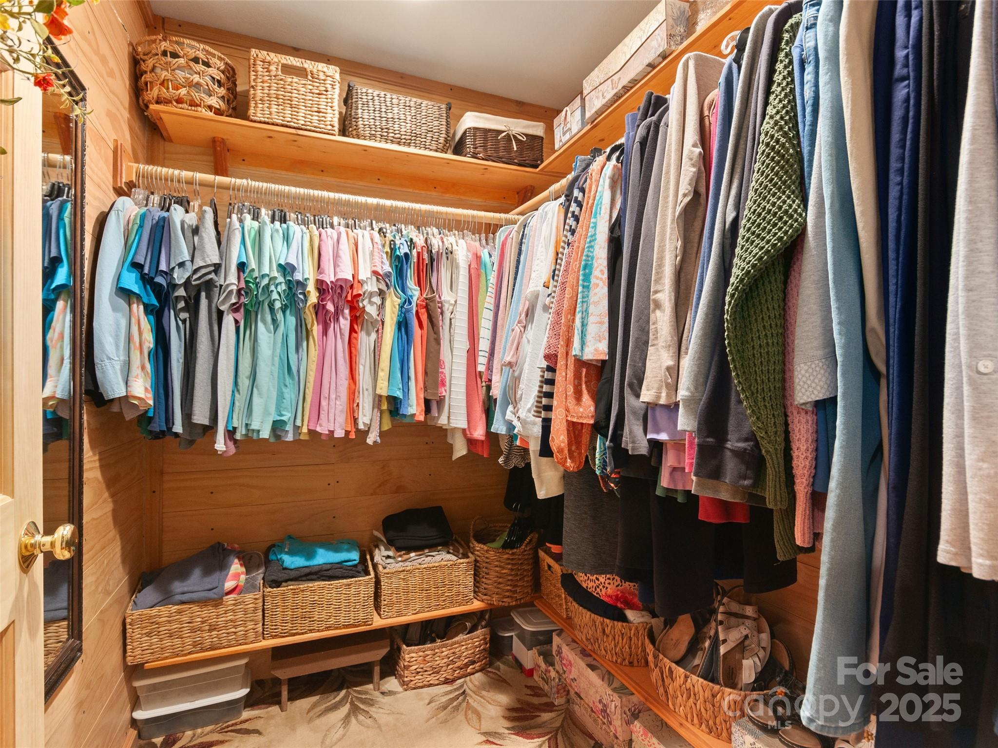 229 Crabtree Mountain Road Canton, NC 28716 - Photo 27 of 42 a view of walk in closet with clothes and shoes
