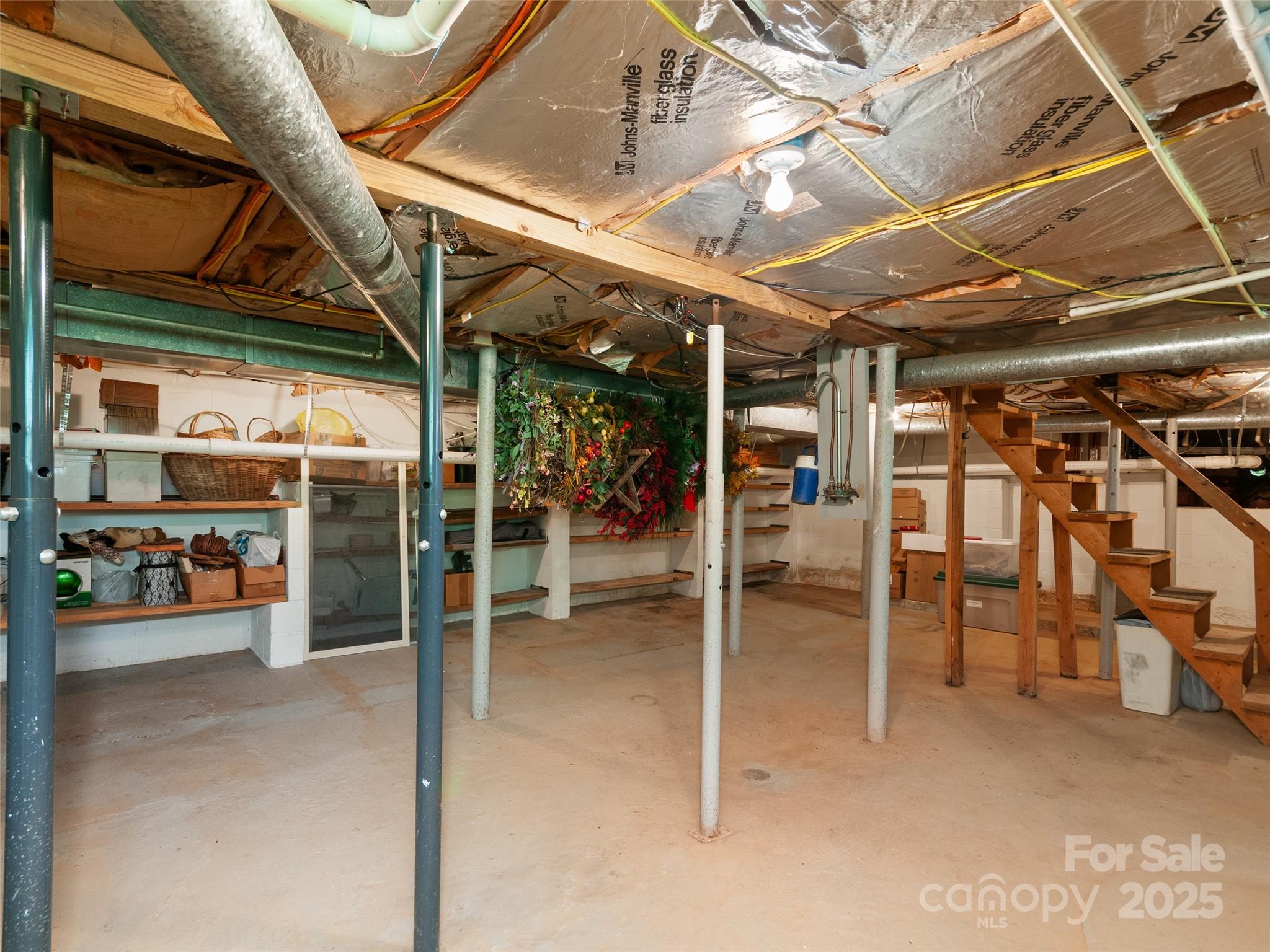 229 Crabtree Mountain Road Canton, NC 28716 - Photo 36 of 42 a view of a room with wooden shelves